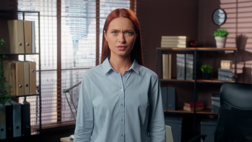 Portrait Caucasian girl angry furious rage mad aggressive business woman female worker businesswoman employer boss in office looking at camera yelling conflict scold argument anger talking screaming
