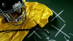 Football helmet and whistle on chalkboard with play diagram and countdown animation. Sports, strategy, game plan, coaching, teamwork, equipment - Powered by Shutterstock - Get 15% off with code: PIKWIZARD15