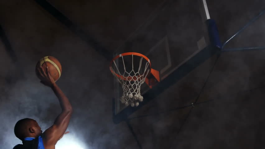 Basketball going through hoop with animation of swirling red and white smoke. Sports, motion, dynamic