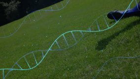 Soccer player kicking ball with DNA strand animation over grassy field. Sports, biology, science, genetics, athlete, motion - Powered by Shutterstock - Get 15% off with code: PIKWIZARD15