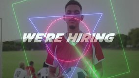 Holding soccer ball with We're Hiring text, player with neon triangle animation. Recruitment, employment, sports, digital, football, opportunity - Powered by Shutterstock - Get 15% off with code: PIKWIZARD15