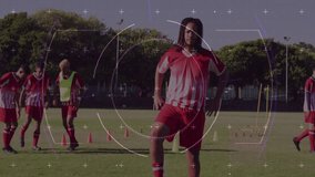 Young soccer players practicing on field with digital targeting animation overlay. teamwork, sports, training, youth, competition, strategy - Powered by Shutterstock - Get 15% off with code: PIKWIZARD15