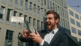Happy rich carefree wealthy winner worker male employer money rain throwing in city businessman business yelling celebrate winning invest success finance growth salary cash holding banknotes man guy - Powered by Shutterstock - Get 15% off with code: PIKWIZARD15