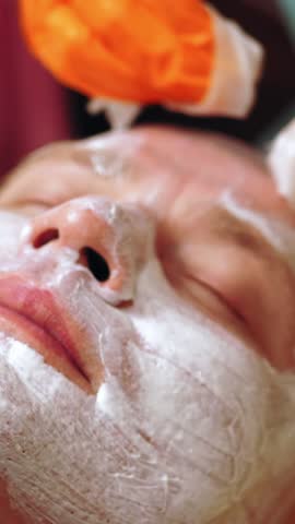Cosmetology, men's face cleaning. cosmetic procedures for men. close-up. man is lying on couch and getting face cleaning procedure, at beauty clinic. Skin care, dermatology treatment.