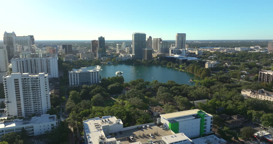 Orlando, Florida. American city downtown architecture with Lake Eola Park and high-rise office buildings. Real estate development in Florida. USA travel destination.