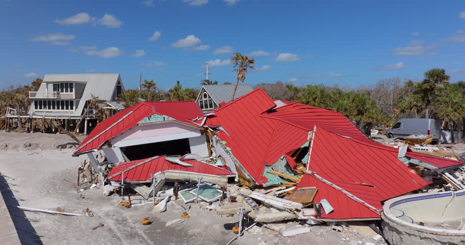 Storm surge severe damage to residential houses on ocean shore after hurricane landfall. Natural disaster consequences in Florida.