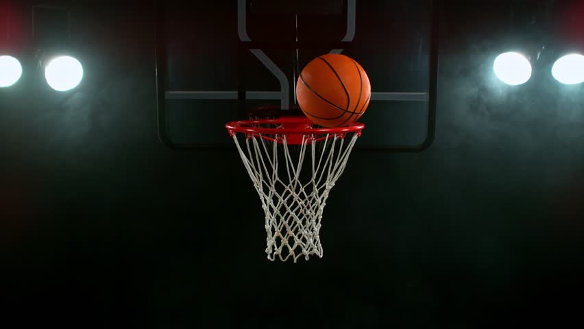 Super slow motion of basketball ball hitting the basket . Filmed on high speed cinema camera , 1000 fps