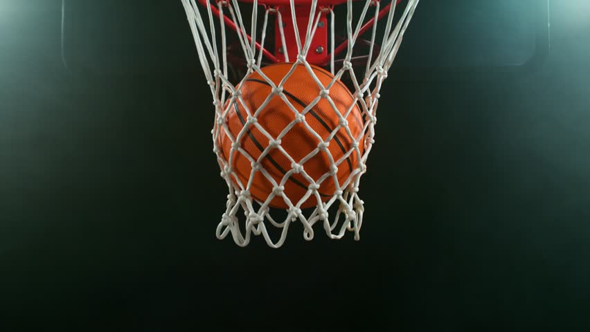 Super slow motion of basketball ball hitting the basket . Filmed on high speed cinema camera , 1000 fps