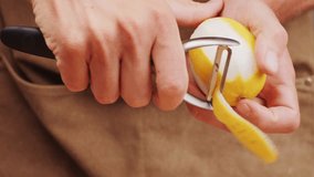 bartender makes a cocktail in a glass with orange peel, barman peeling orange or lemon.  - Powered by Shutterstock - Get 15% off with code: PIKWIZARD15