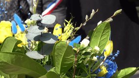 French officials wearing tricolor sashes participating in a pro-Ukrainian demonstration, showing political support and solidarity. - Powered by Shutterstock - Get 15% off with code: PIKWIZARD15