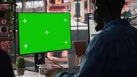 Call center agent using mockup green screen PC, providing step by step guidance to customers. Happy customer center worker using chroma key computer, diagnosing problems for clients, camera A - Powered by Shutterstock - Get 15% off with code: PIKWIZARD15