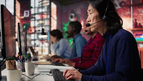 Call center agent using AI chatbot to provide quick and accurate replies to common customer queries. Customer service representative generating automated responses to clients using AI, camera B - Powered by Shutterstock - Get 15% off with code: PIKWIZARD15