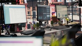 PC displays in empty office showing analytics dashboards and data graphs. Office workspace with screens showing digital data visualization and operational management, handheld camera shot - Powered by Shutterstock - Get 15% off with code: PIKWIZARD15