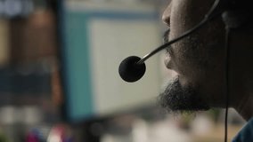 Closeup of call center agent providing support, handling clients complaints, speaking in audio headset mic. Employee dealing with unsatisfied customers, talking in headphones mic, camera A - Powered by Shutterstock - Get 15% off with code: PIKWIZARD15