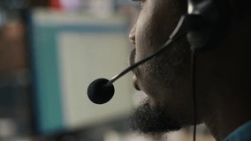 Closeup of call center agent providing support, handling clients complaints, speaking in audio headset mic. Employee dealing with unsatisfied customers, talking in headphones mic, camera A - Powered by Shutterstock - Get 15% off with code: PIKWIZARD15
