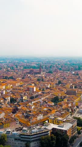 Vertical video. Piacenza, Italy. Cathedral of Piacenza. Episcopal Palace. Historical city center. Summer day, Aerial View. Rich colors
