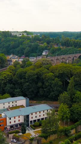 Vertical video. Luxembourg City, Luxembourg. Bock Casemates. Panoramic view of the historical part of Luxembourg city. The city is located in a deep valley of two rivers - Alzette and Petrus, Aerial