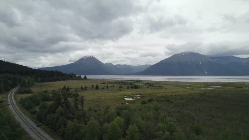 Vast lake and high mountains of Alaska, aerial drone view