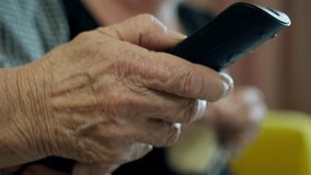 Elderly woman holding a remote control - Powered by Shutterstock - Get 15% off with code: PIKWIZARD15