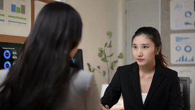 Professional businesswoman explaining complex work concept, growing increasingly frustrated while colleague struggles to comprehend challenging information in corporate office setting - Powered by Shutterstock - Get 15% off with code: PIKWIZARD15