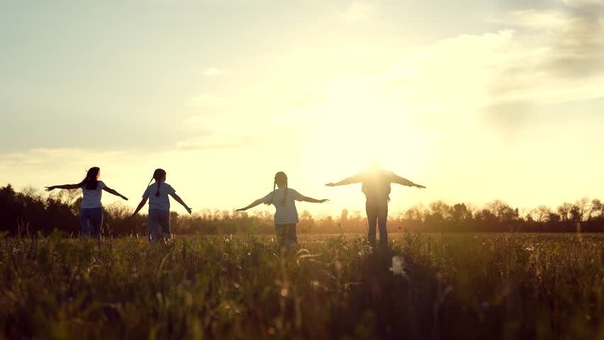 happy family running through field sunset, family child kid mother father running dream, Children Playing Field Sunset, Joyful Kid Outstretched Arms, Family Fun Nature, Carefree Childhood Moments