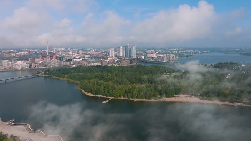 Aerial view over the Mustikkamaa island, toward Kalasatama, Helsinki, foggy day