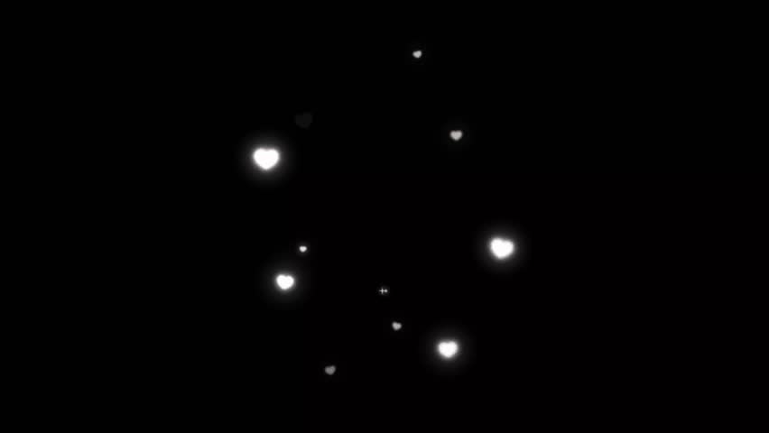 A whimsical display of glowing white hearts of varying sizes and sparkles on a black background. The charming arrangement creates a magical, enchanting visual effect