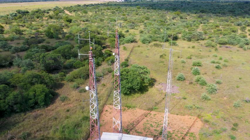 aerial view of array of towers mast antennas station in the African bush