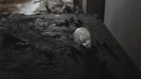 A broken light bulb in an abandoned building among the ruins. - Powered by Shutterstock - Get 15% off with code: PIKWIZARD15