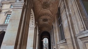 Ornate historical archway with stone carvings in the European architecture near the Louvre Museum, Paris, France. - Powered by Shutterstock - Get 15% off with code: PIKWIZARD15