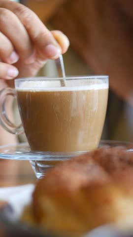 Perfect morning coffee and pastry enjoyed in a cozy cafe