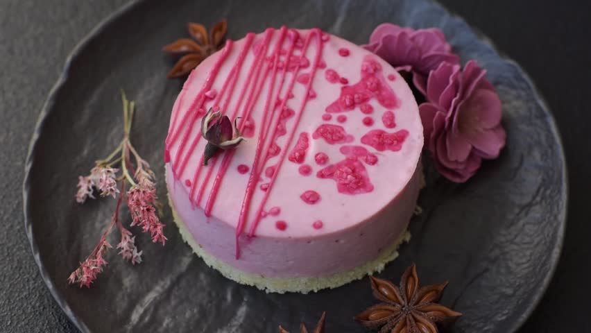 Sweet round tart cheesecake with raspberries or strawberries on dark concrete background