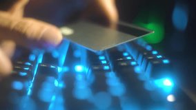 The blurring of the background creates the effect of a digital environment, where the card in hand and the keyboard symbolize the protection of online transactions. Online payments are protected: the - Powered by Shutterstock - Get 15% off with code: PIKWIZARD15