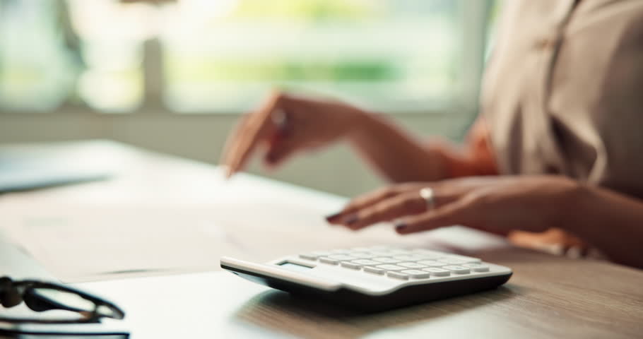 Hands, documents and calculator for finance agency as accountant with audit, planning and investing. Person, bookkeeping and corporate taxes for loan, paperwork or payroll in asset management or bank