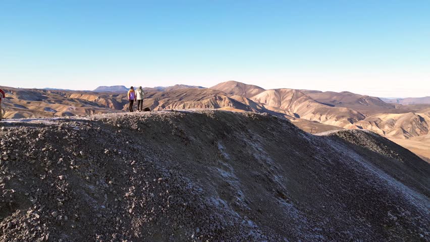 Aerial view of the colorful rhyolite mountains and geothermal valleys of Landmannalaugar in Iceland. Breathtaking volcanic landscape shaped by nature.