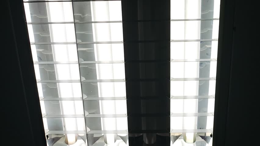 Flickering Neon Lamp Casting Hypnotic Ceiling Glow