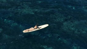 Woman on longboard in blue ocean. Surfer girl during surfing - Powered by Shutterstock - Get 15% off with code: PIKWIZARD15
