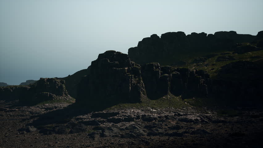 A significant rock formation prominently situated on the side of a mountain, showcasing the forces of nature at work.