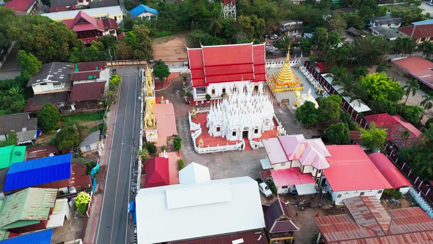 Aerial fly above monastery Buddhist house in Thailand, Phrae province tropical village