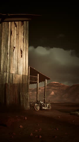 A motorcycle parked neatly in front of a rustic wooden building, under a clear sky.