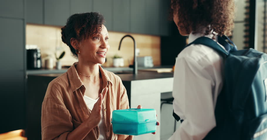 Care, lunch and mother with child for school preparation, support and talk with food box for first day in home. Kid, mom and student ready for education, learning and morning routine of happy family