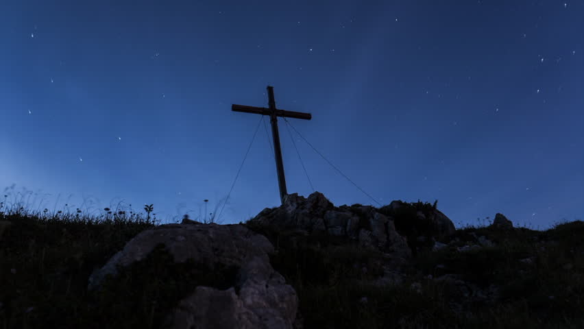 Time lapse of summit cross in the moon light at Benediktenwand mountain, Bavaria, high definition