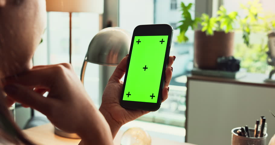 Smartphone, hands and green screen for communication, mockup and branding as digital ux in home. Person, mobile technology and connection in ui, network or internet for online, website or application