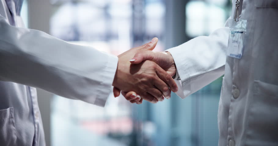 Handshake, medical and scientists in laboratory with partnership for pharmaceutical innovation. Agreement, science and professional biologists shaking hands for healthcare deal, collaboration or team