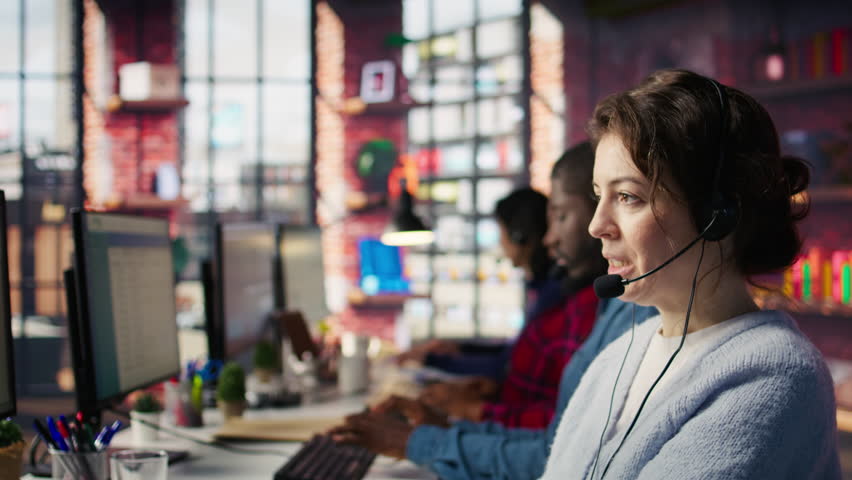 Account manager handling customer inquiries, complaints and support requests in office. Customer service worker assists customers with issues related to products or services, camera B extreme closeup