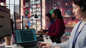 Call center agent uses AI chatbot on laptop to provide quick and accurate replies to common customer questions. Customer service worker generates automated responses using AI LLM on notebook, camera B - Powered by Shutterstock - Get 15% off with code: PIKWIZARD15