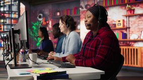 Smiling call center agent assisting customers through digital communication channels. Customer support employee using computer to have conversation with client in live chat, camera B - Powered by Shutterstock - Get 15% off with code: PIKWIZARD15