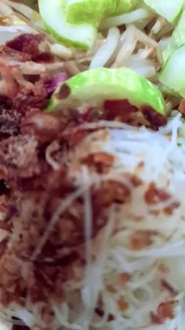 Video of authentic Indonesian food, namely gado-gado or mixed vegetables with peanut sauce.