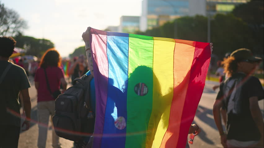 Gay have fun festival go city street. Happy people crowd hang out queer community party. Bi men walk lgbt pride fest. Lgbtq coming out bisexual show. Colorful rainbow flag symbol. Joy parade march