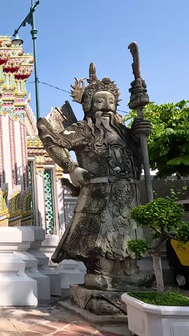 Statue and temple entrance in Bangkok, Thailand